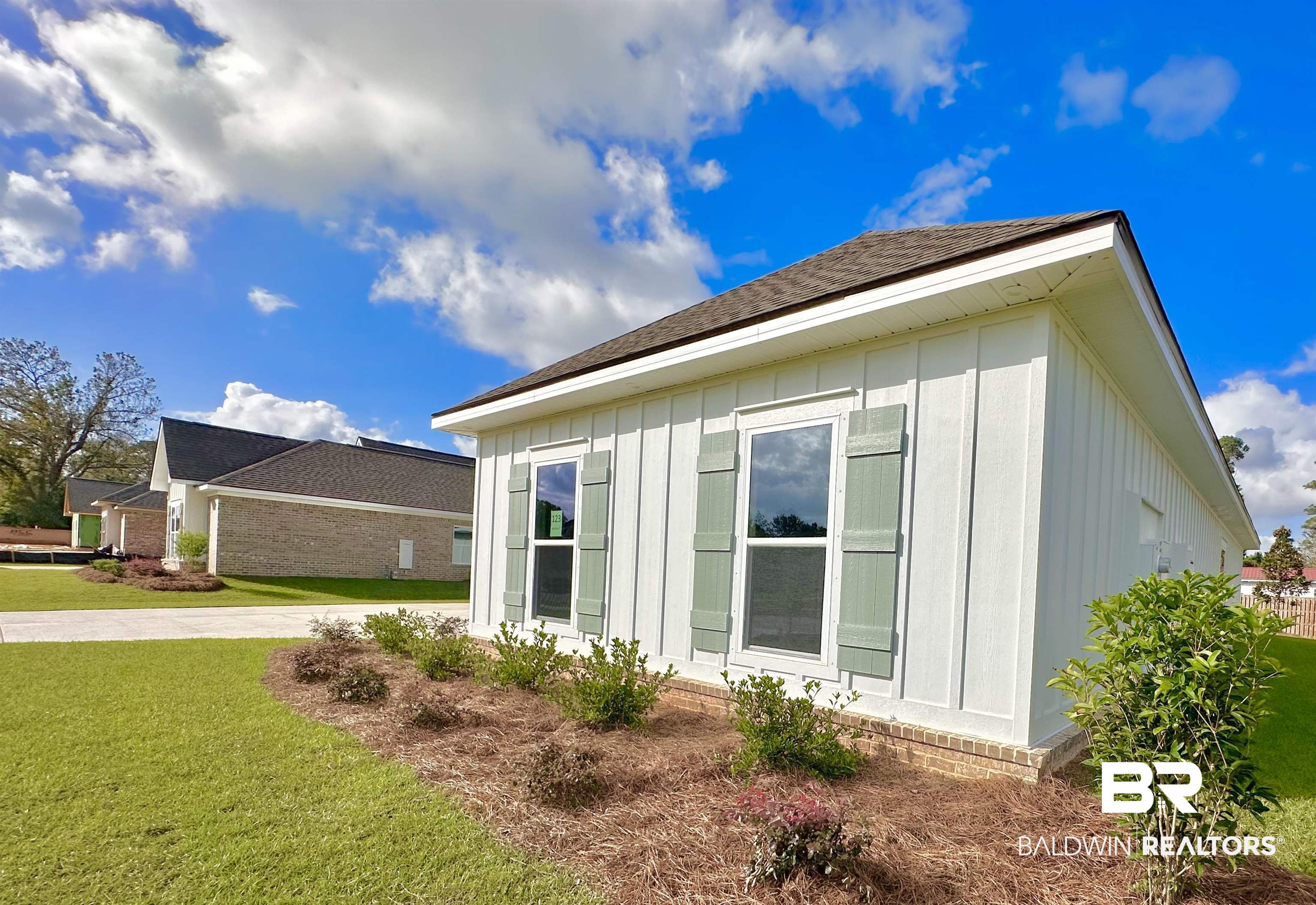 634 Kitfox Avenue Fairhope, AL 36532 - Photo 30 of 33 View of property exterior with a lawn
