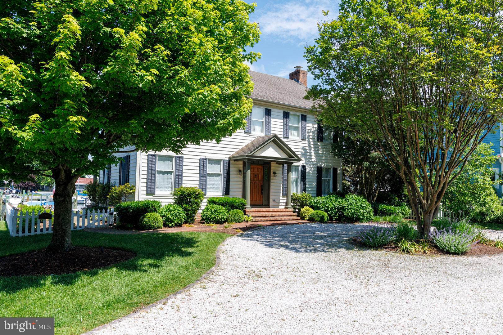 222 East Chestnut Street St. Michaels, MD 21663 - Photo 1 of 38 a front view of a house with a yard