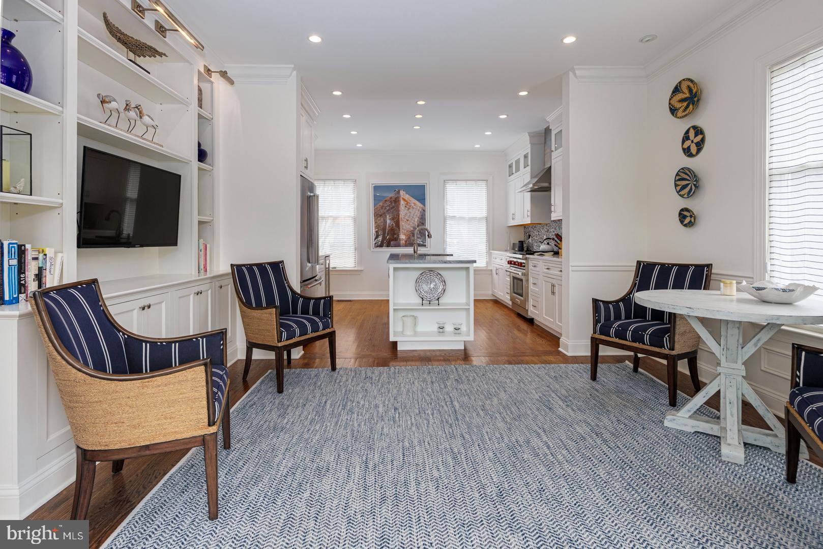 222 East Chestnut Street St. Michaels, MD 21663 - Photo 13 of 38 a living room with fireplace furniture and a flat screen tv