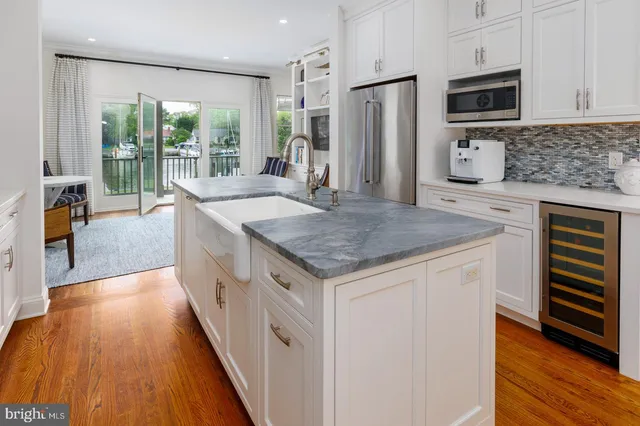 a kitchen with stainless steel appliances granite countertop a stove and a sink
