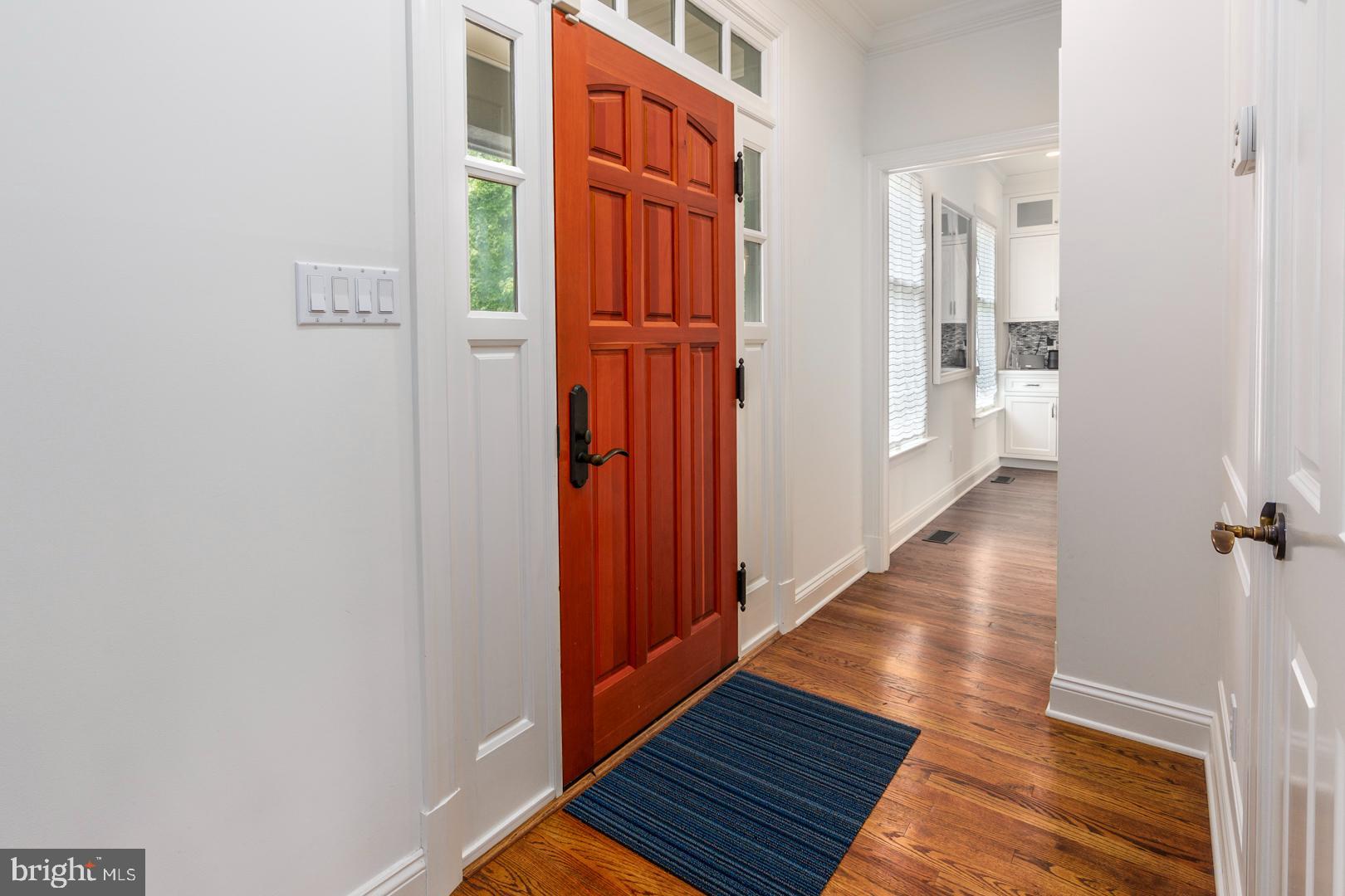 222 East Chestnut Street St. Michaels, MD 21663 - Photo 27 of 38 a view of a hallway with wooden floor and staircase