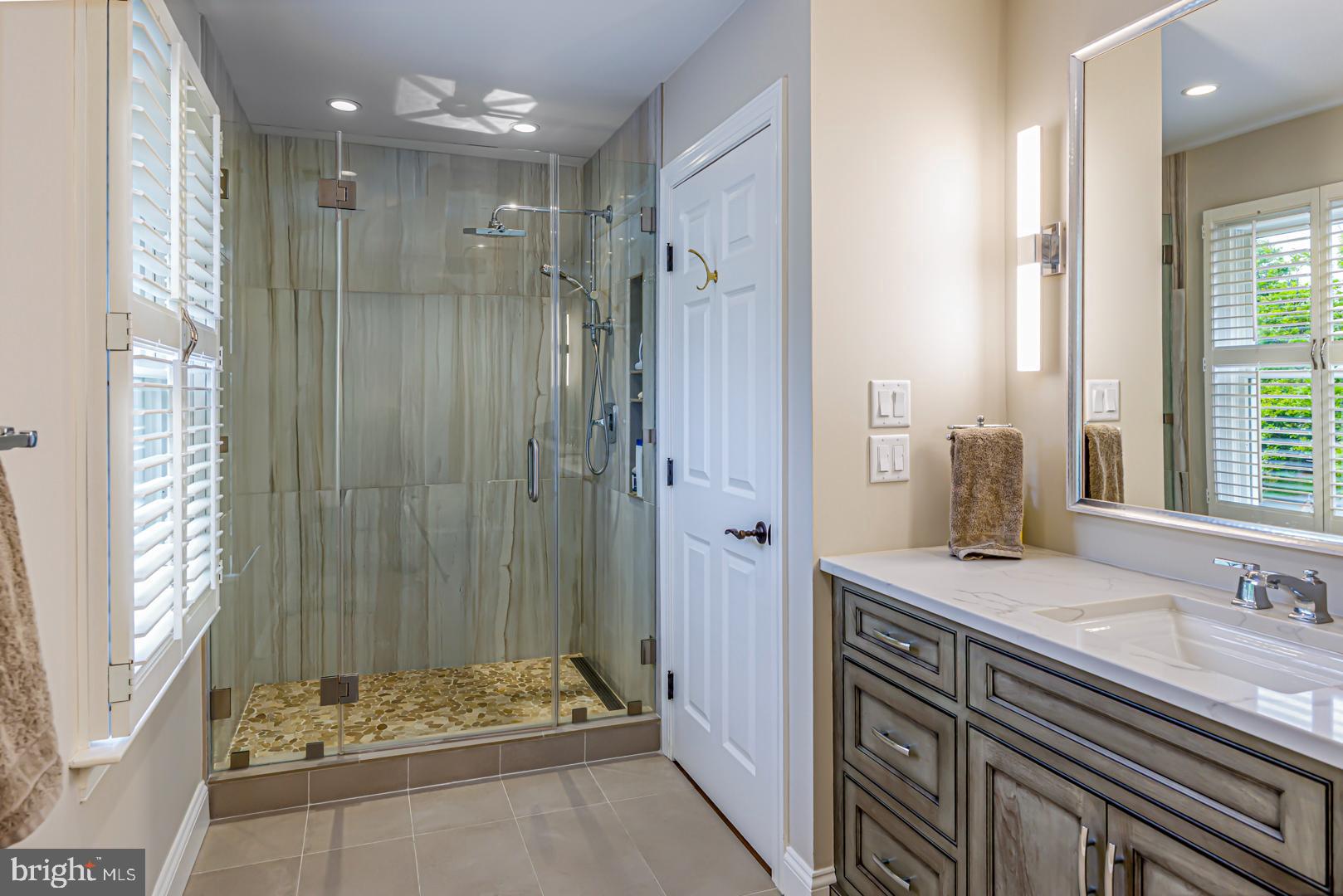222 East Chestnut Street St. Michaels, MD 21663 - Photo 3 of 38 a bathroom with a sink and a mirror