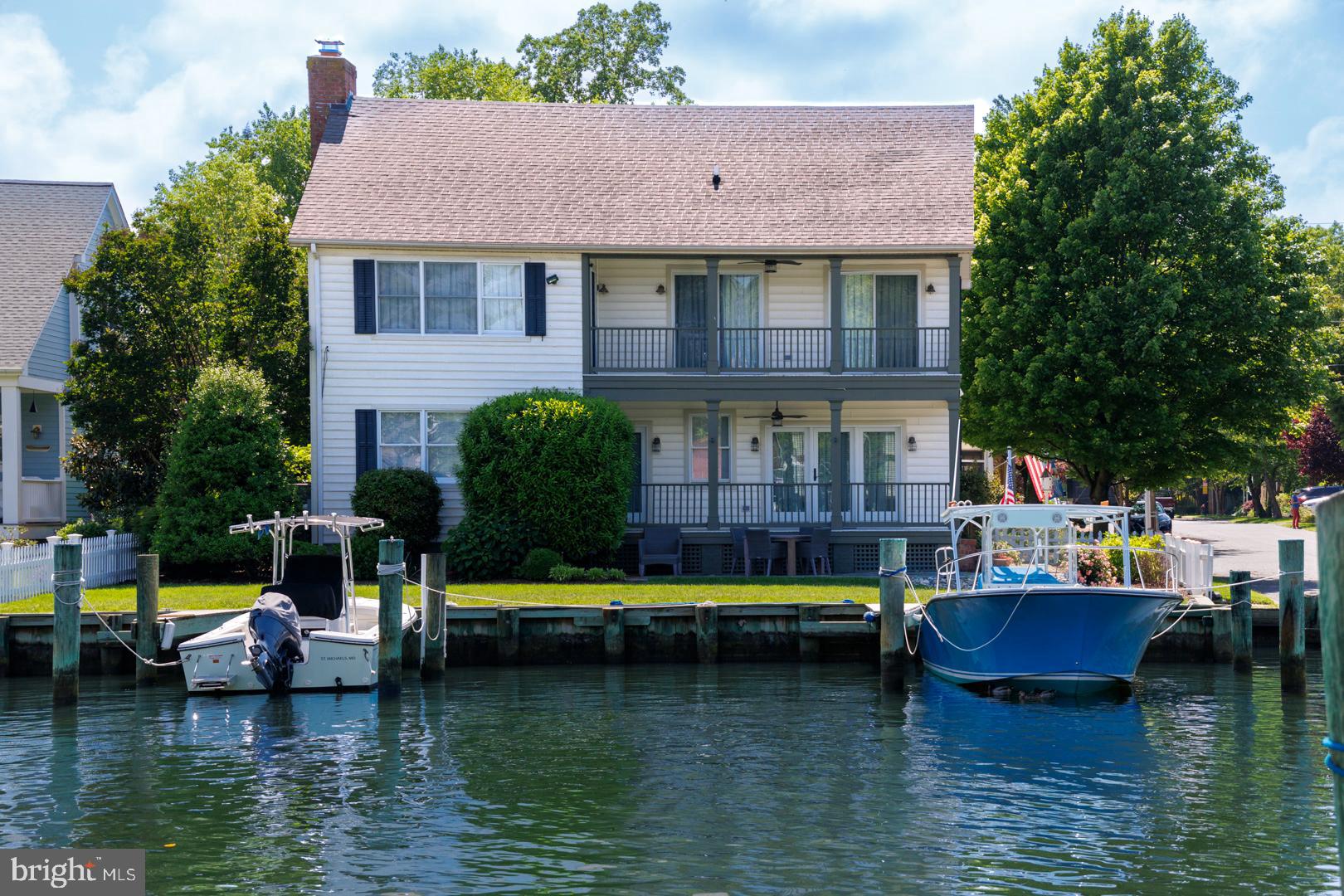 222 East Chestnut Street St. Michaels, MD 21663 - Photo 32 of 38 a view of a building with swimming pool and a chairs