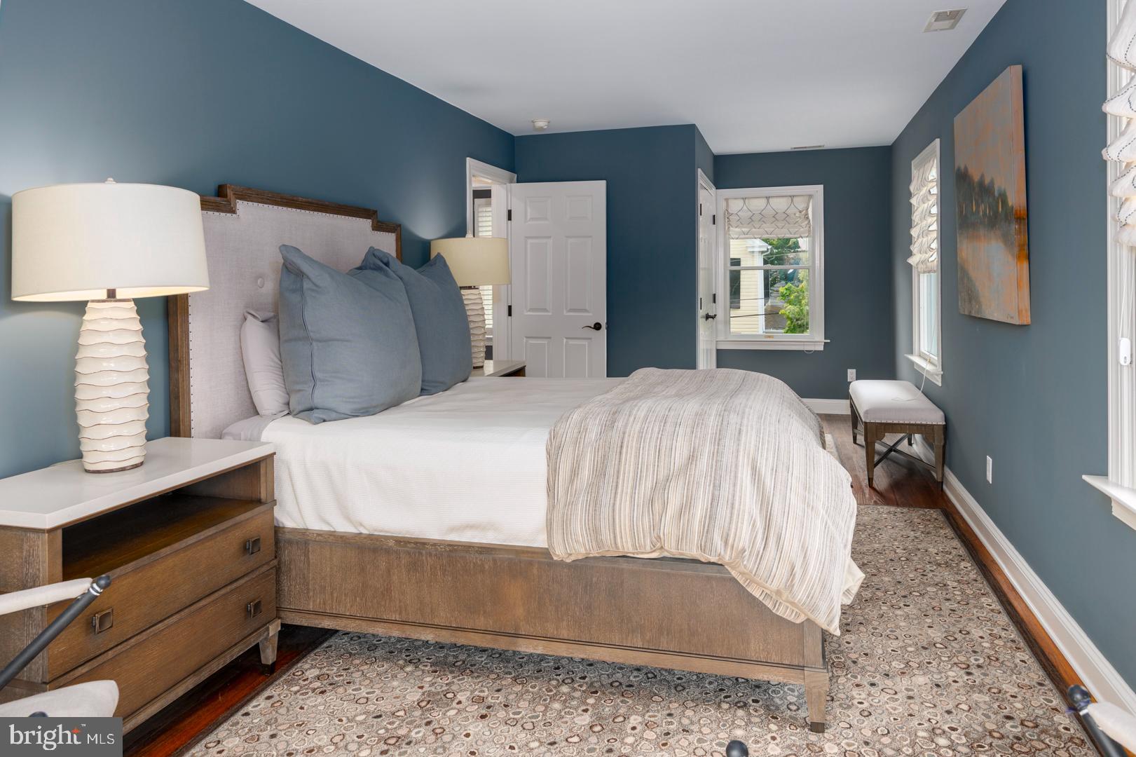 222 East Chestnut Street St. Michaels, MD 21663 - Photo 8 of 38 a bedroom with a bed and window