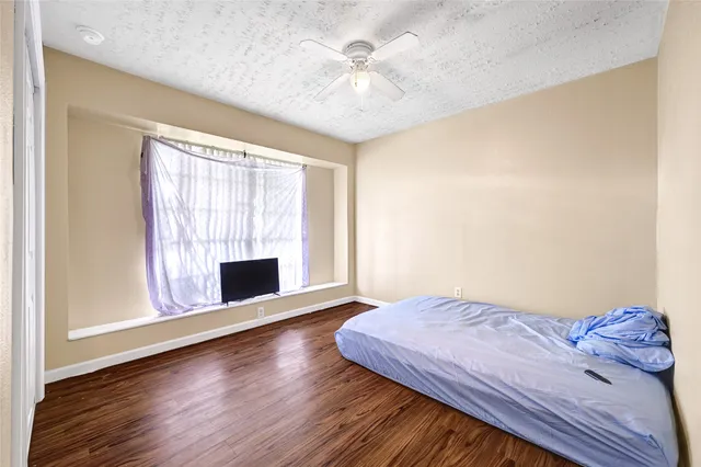 a bedroom with a bed and a fireplace