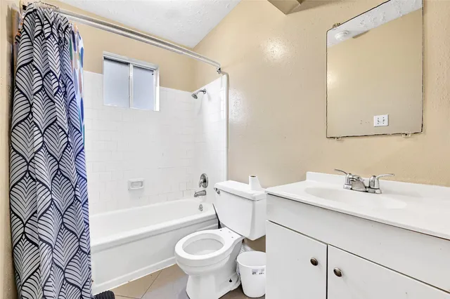 a bathroom with a sink a toilet and a bathtub