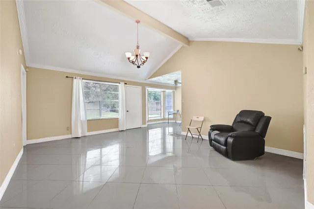 a living room with furniture and window