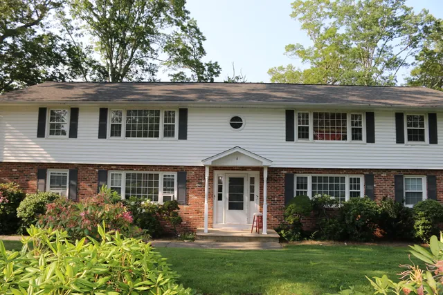 front view of a house with a yard
