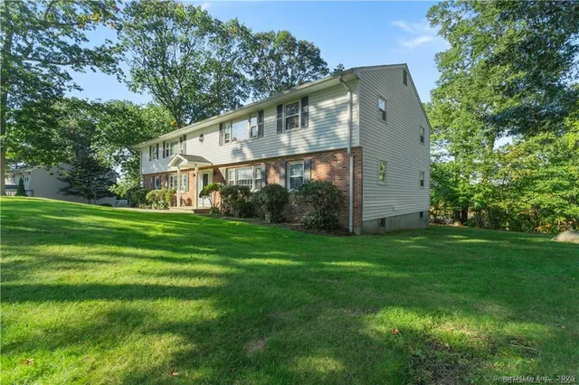 a front view of house with garden