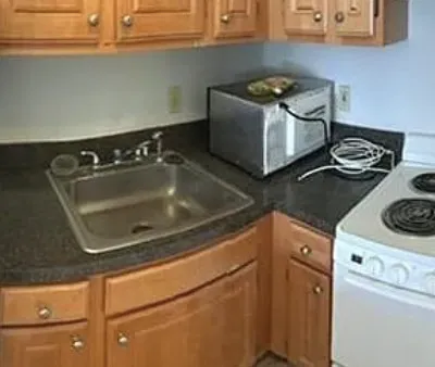 a kitchen with a stove and a sink