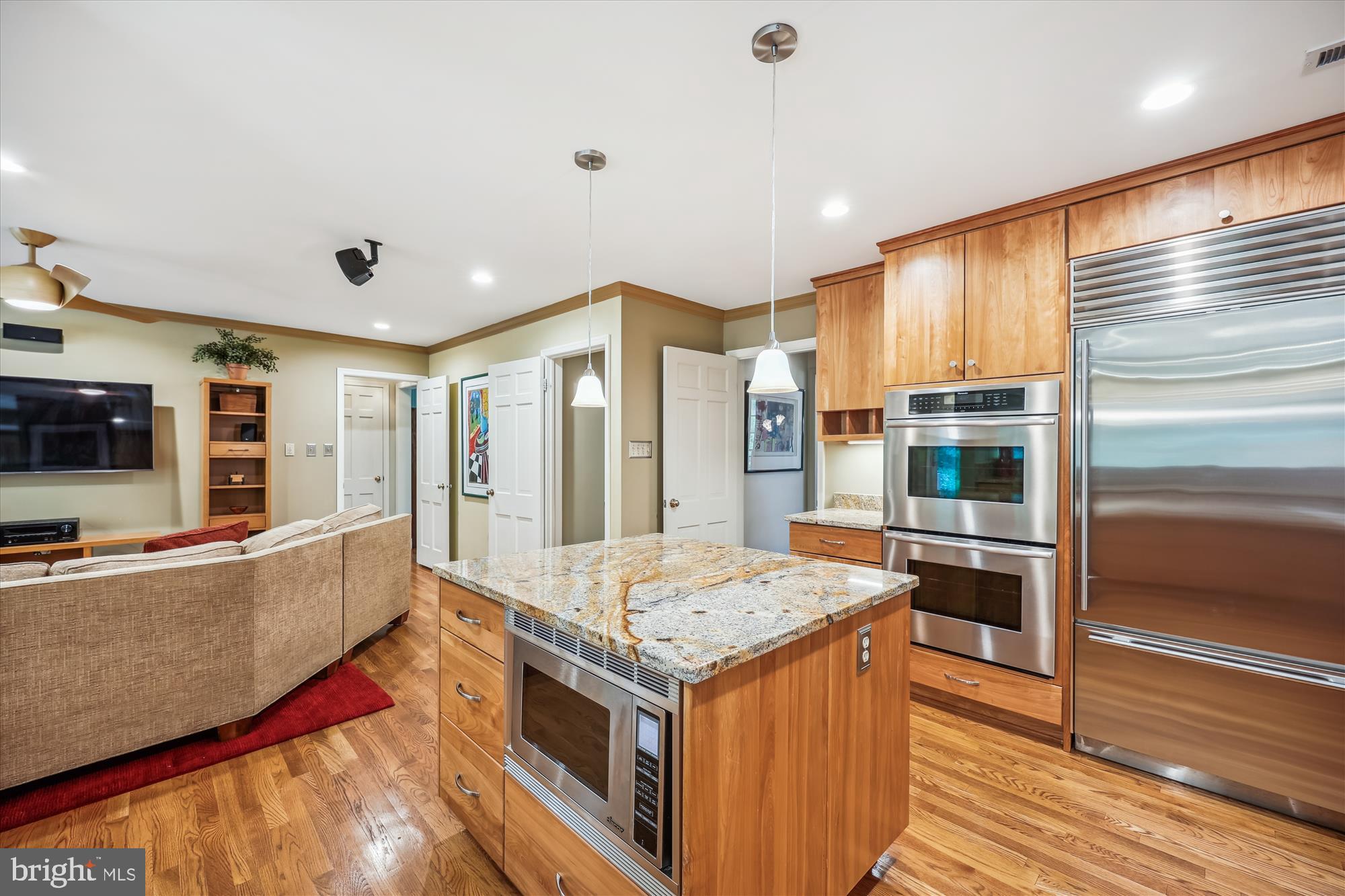 7212 Old Gate Road Rockville, MD 20852 - Photo 14 of 50 a kitchen with stainless steel appliances granite countertop a stove and a refrigerator