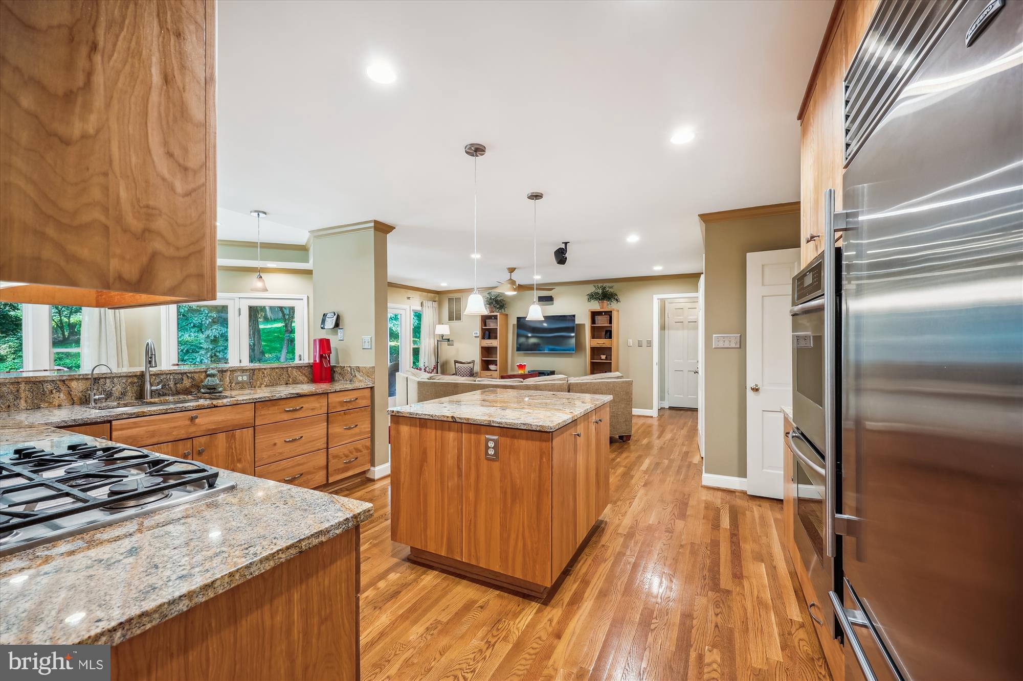 7212 Old Gate Road Rockville, MD 20852 - Photo 15 of 50 a kitchen with stainless steel appliances granite countertop a stove and a refrigerator