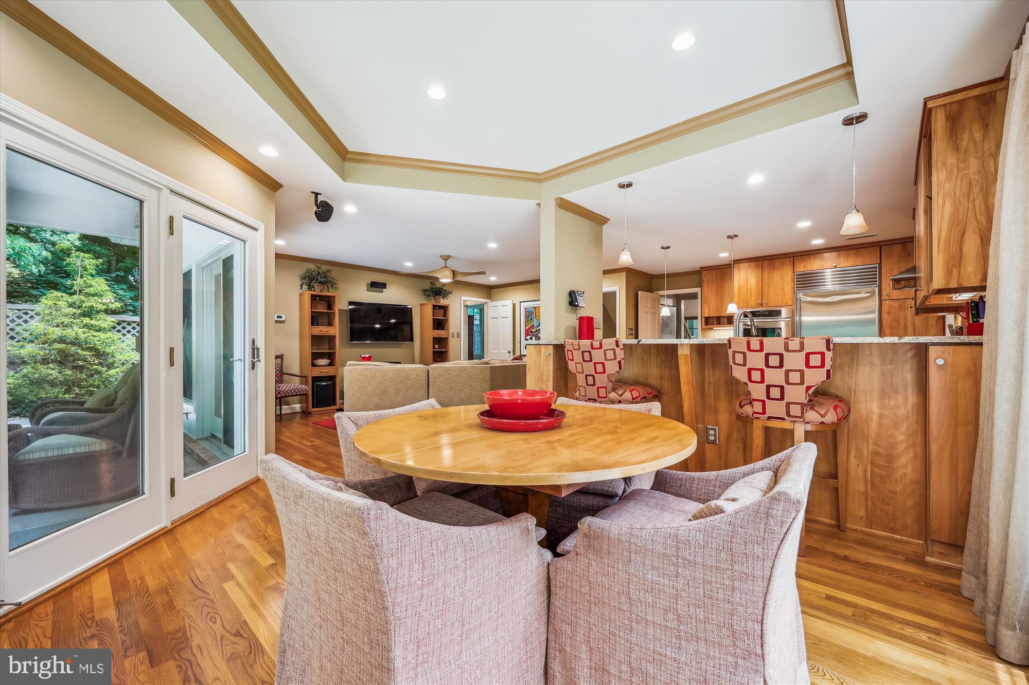 7212 Old Gate Road Rockville, MD 20852 - Photo 17 of 50 a dining room with furniture and a floor to ceiling window