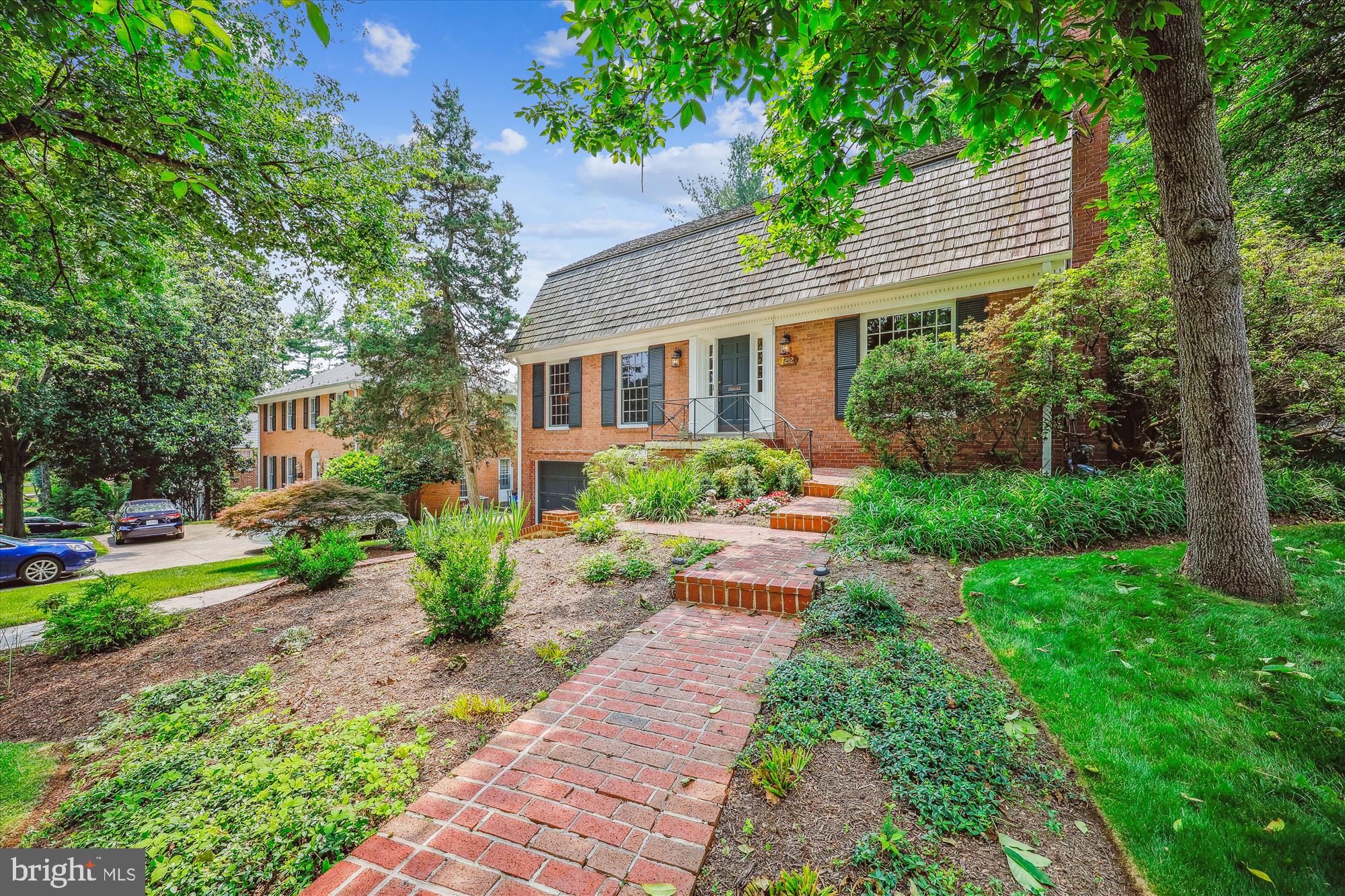 7212 Old Gate Road Rockville, MD 20852 - Photo 2 of 50 a front view of a house with garden and porch