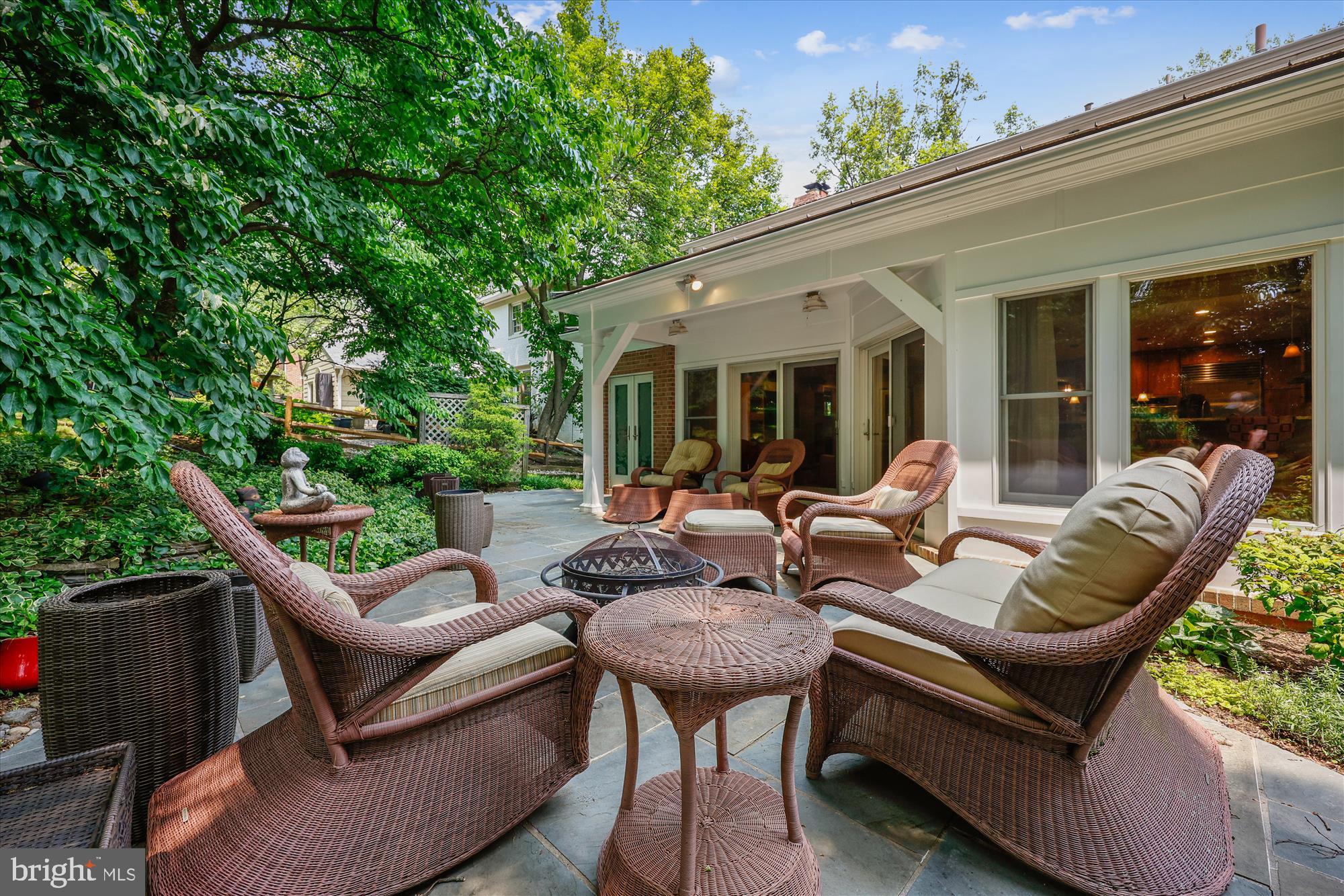 7212 Old Gate Road Rockville, MD 20852 - Photo 24 of 50 a view of a patio with couches table and chairs and potted plants