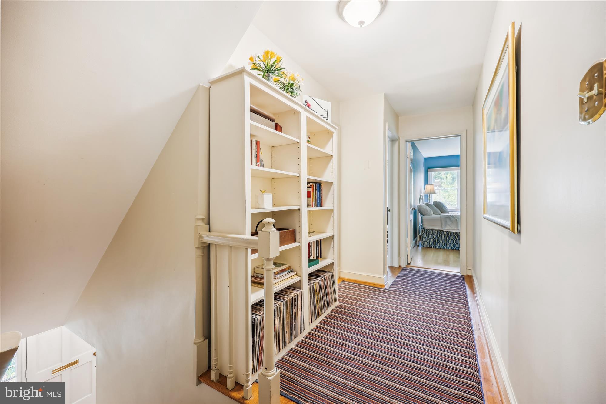 7212 Old Gate Road Rockville, MD 20852 - Photo 26 of 50 a view of a hallway with wooden floor and staircase