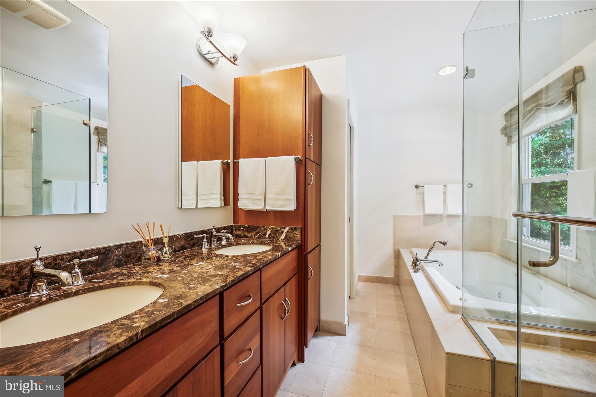 7212 Old Gate Road Rockville, MD 20852 - Photo 30 of 50 a spacious bathroom with a granite countertop sink and a large mirror