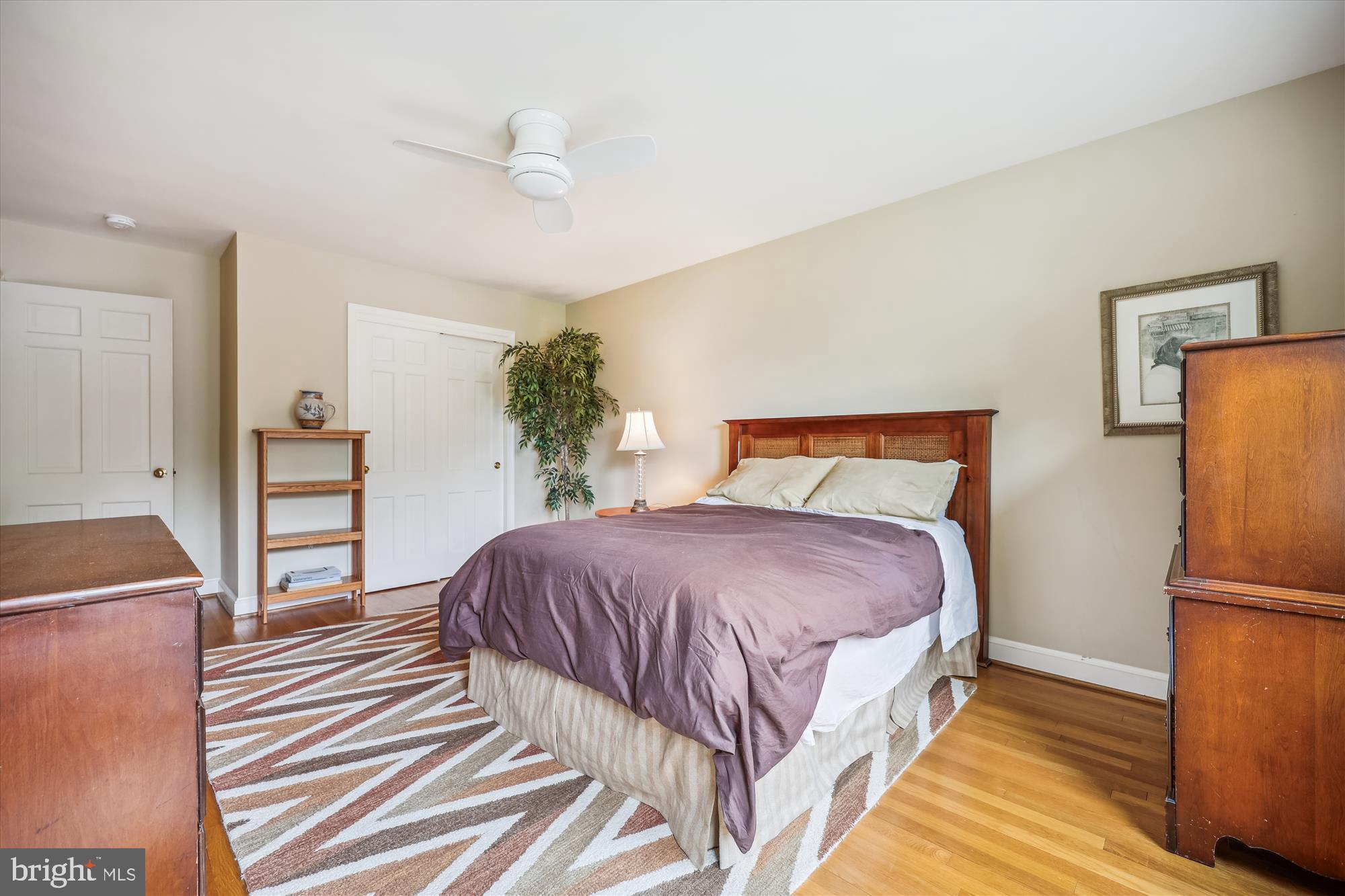7212 Old Gate Road Rockville, MD 20852 - Photo 37 of 50 a spacious bedroom with a bed and a refrigerator