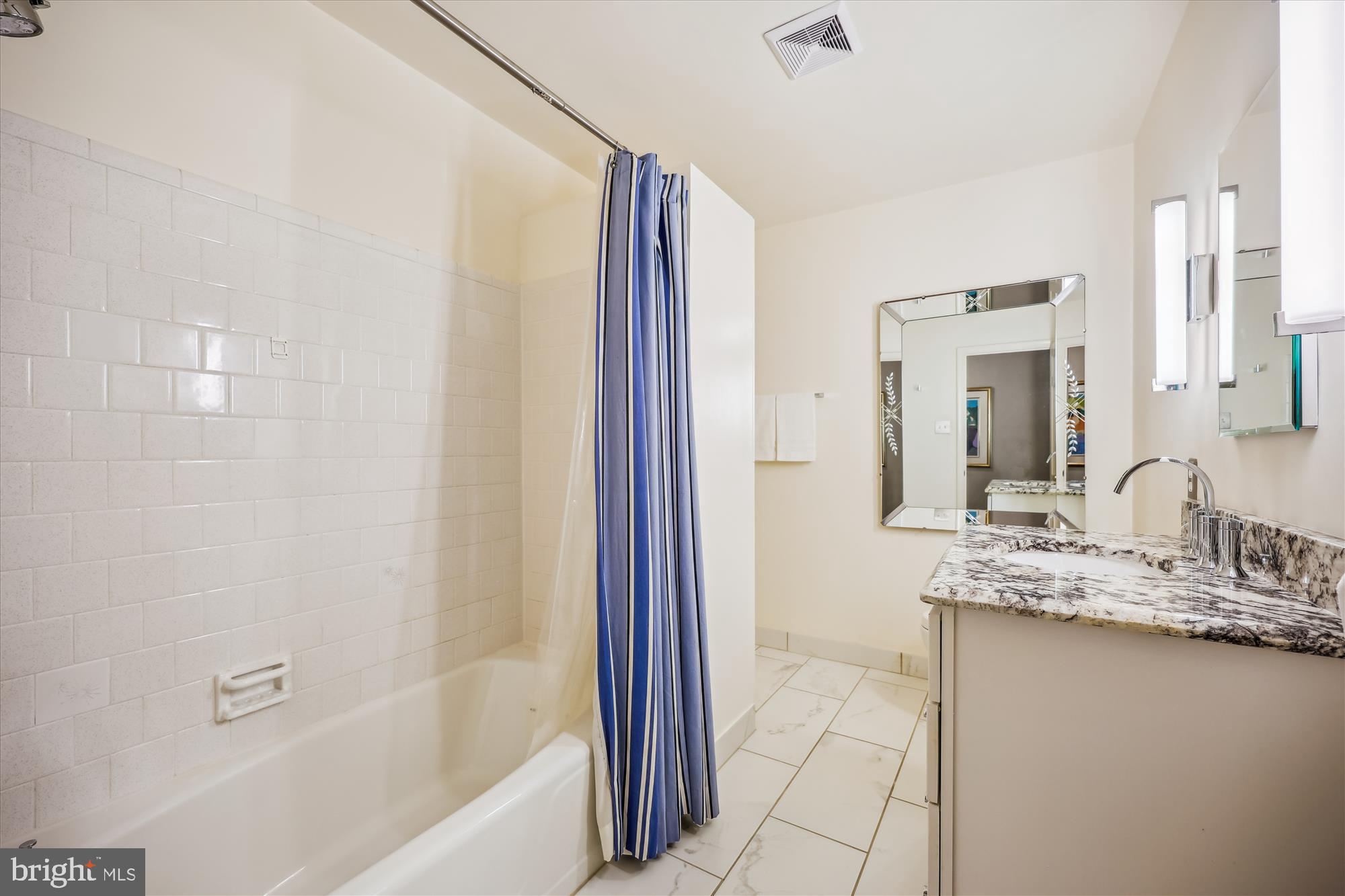 7212 Old Gate Road Rockville, MD 20852 - Photo 38 of 50 a bathroom with a granite countertop sink and a mirror