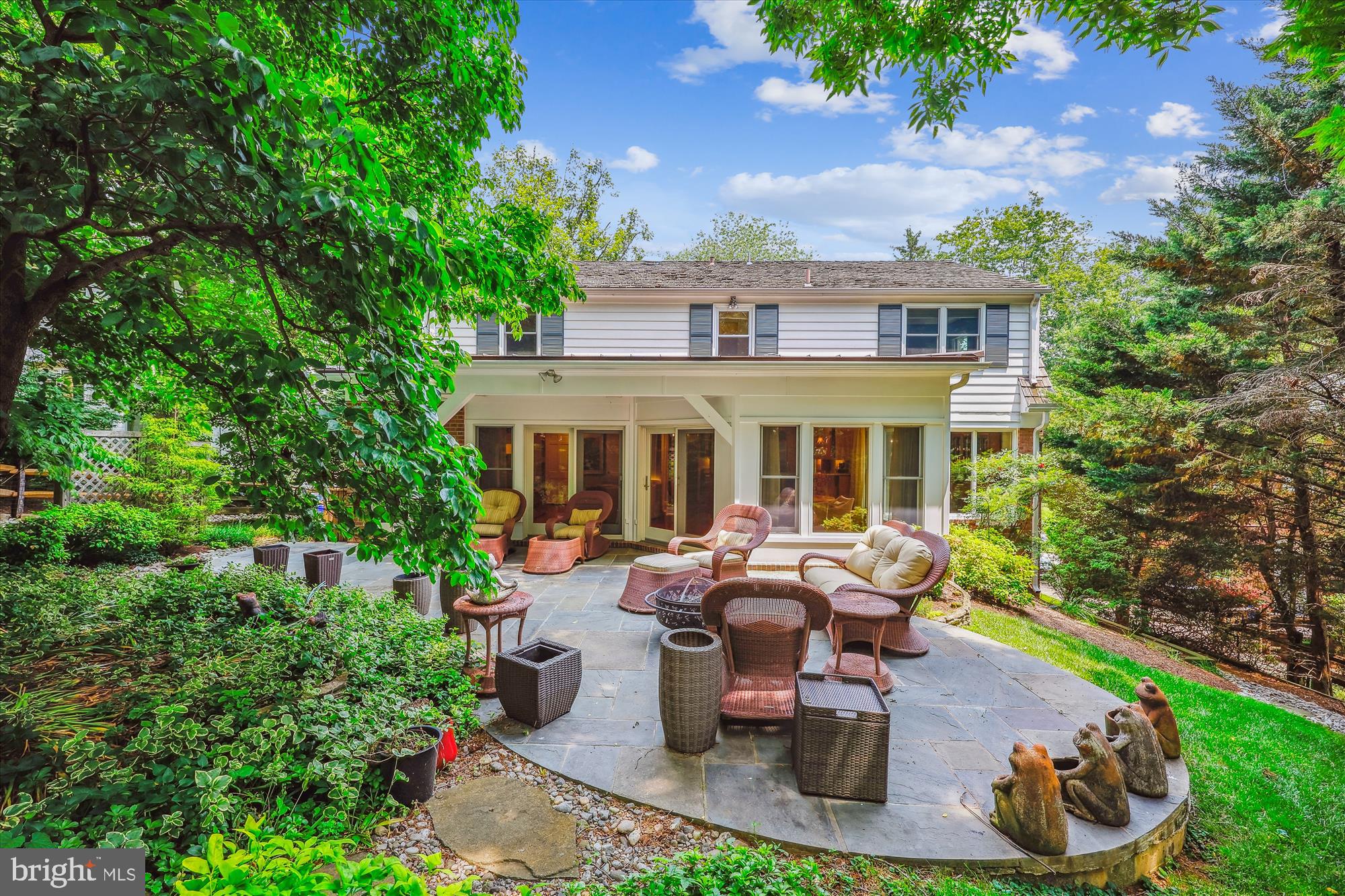 7212 Old Gate Road Rockville, MD 20852 - Photo 49 of 50 a view of a patio with table and chairs potted plants and large tree