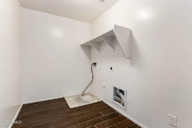 a room with stairs and wooden floor