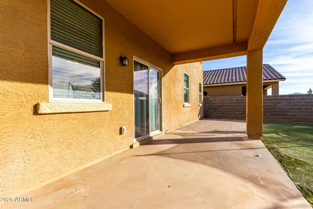 a view of a house with a door and a floor to ceiling window