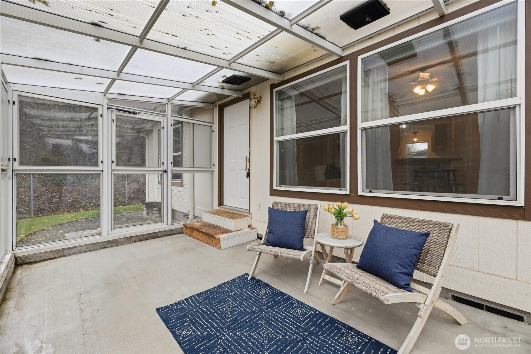 579 Lupine Lane, Unit 16 Burlington, WA 98233 - Photo 11 of 37 a living room with a couch and a floor to ceiling window