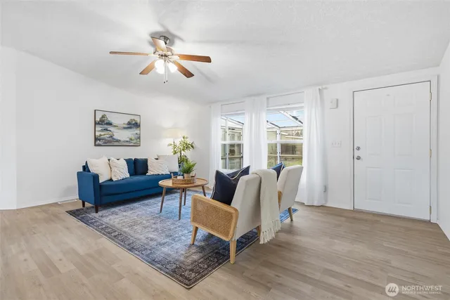a living room with furniture and a large window