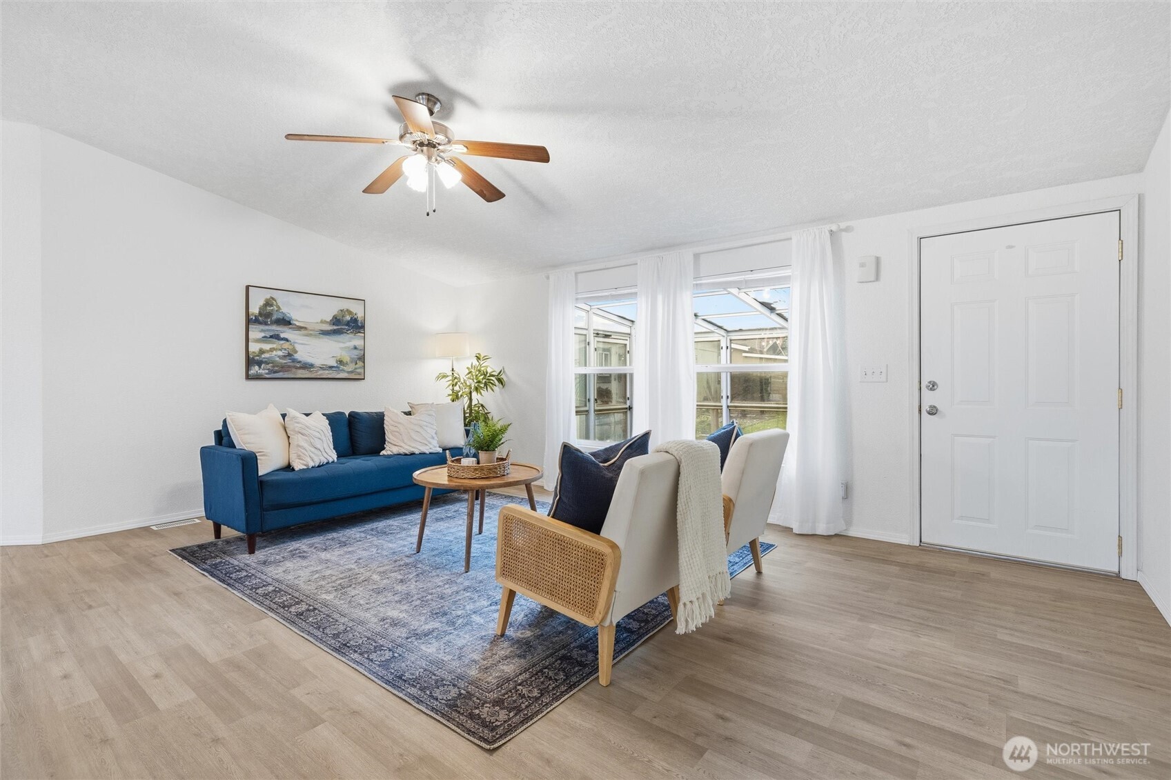579 Lupine Lane, Unit 16 Burlington, WA 98233 - Photo 12 of 37 a living room with furniture and a large window