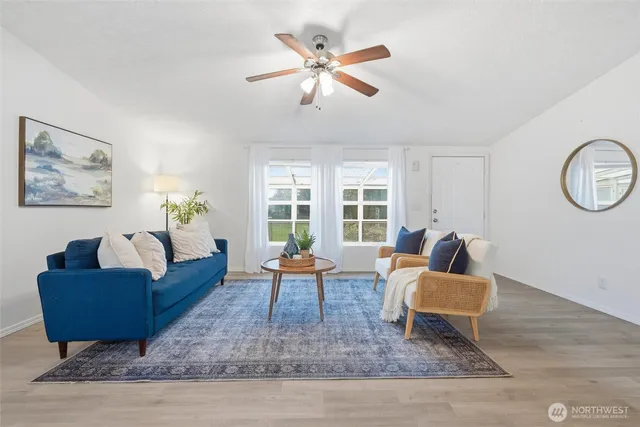 a living room with furniture and a large window