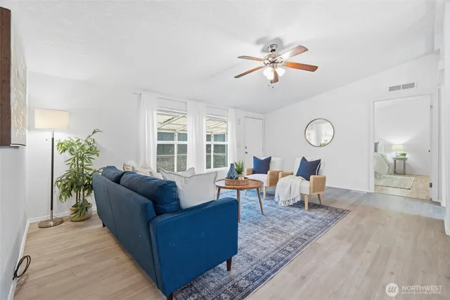 a view of a dining room with furniture and window