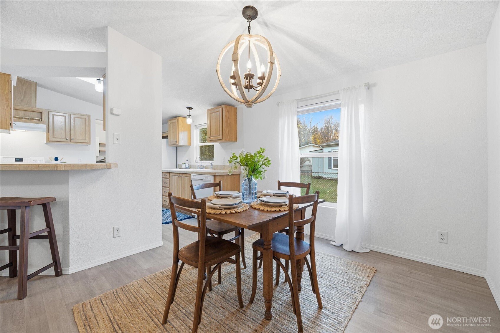 579 Lupine Lane, Unit 16 Burlington, WA 98233 - Photo 15 of 37 a view of a dining room with furniture and window
