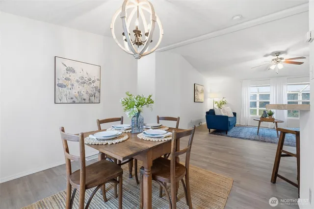 a view of a dining room with furniture and wooden floor