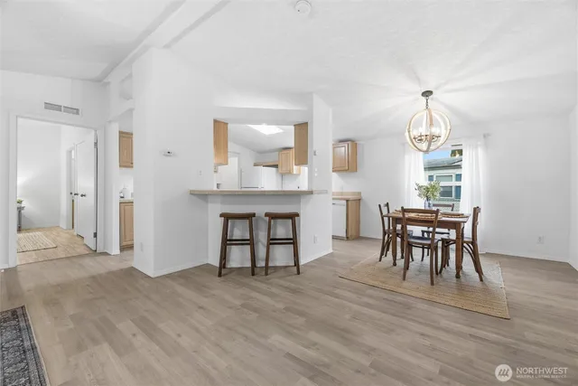 a kitchen with a sink stove and refrigerator