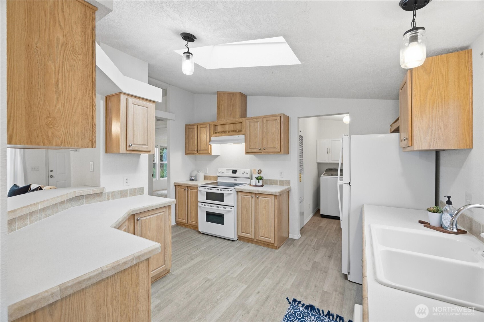 579 Lupine Lane, Unit 16 Burlington, WA 98233 - Photo 18 of 37 a kitchen with a sink stove and refrigerator