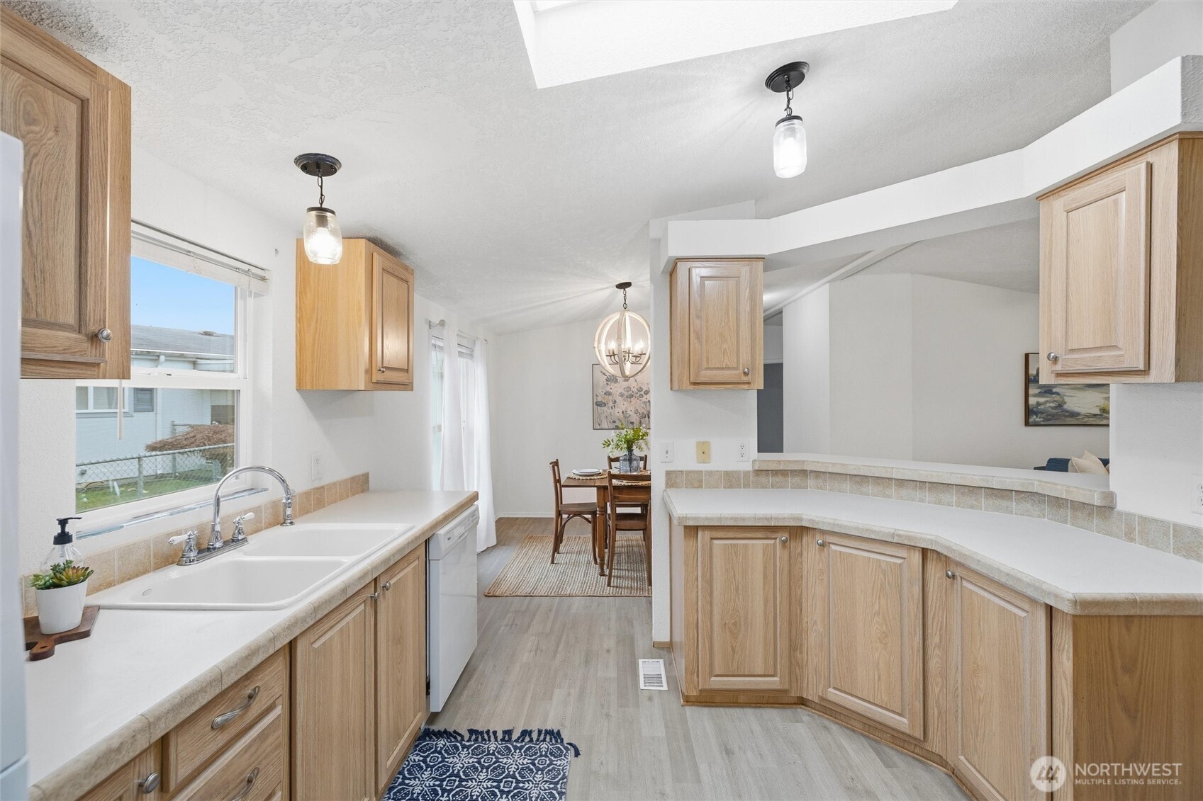 579 Lupine Lane, Unit 16 Burlington, WA 98233 - Photo 19 of 37 a kitchen with a sink stove and cabinets
