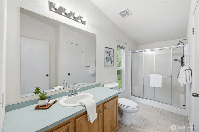 a living room with furniture and a dining table