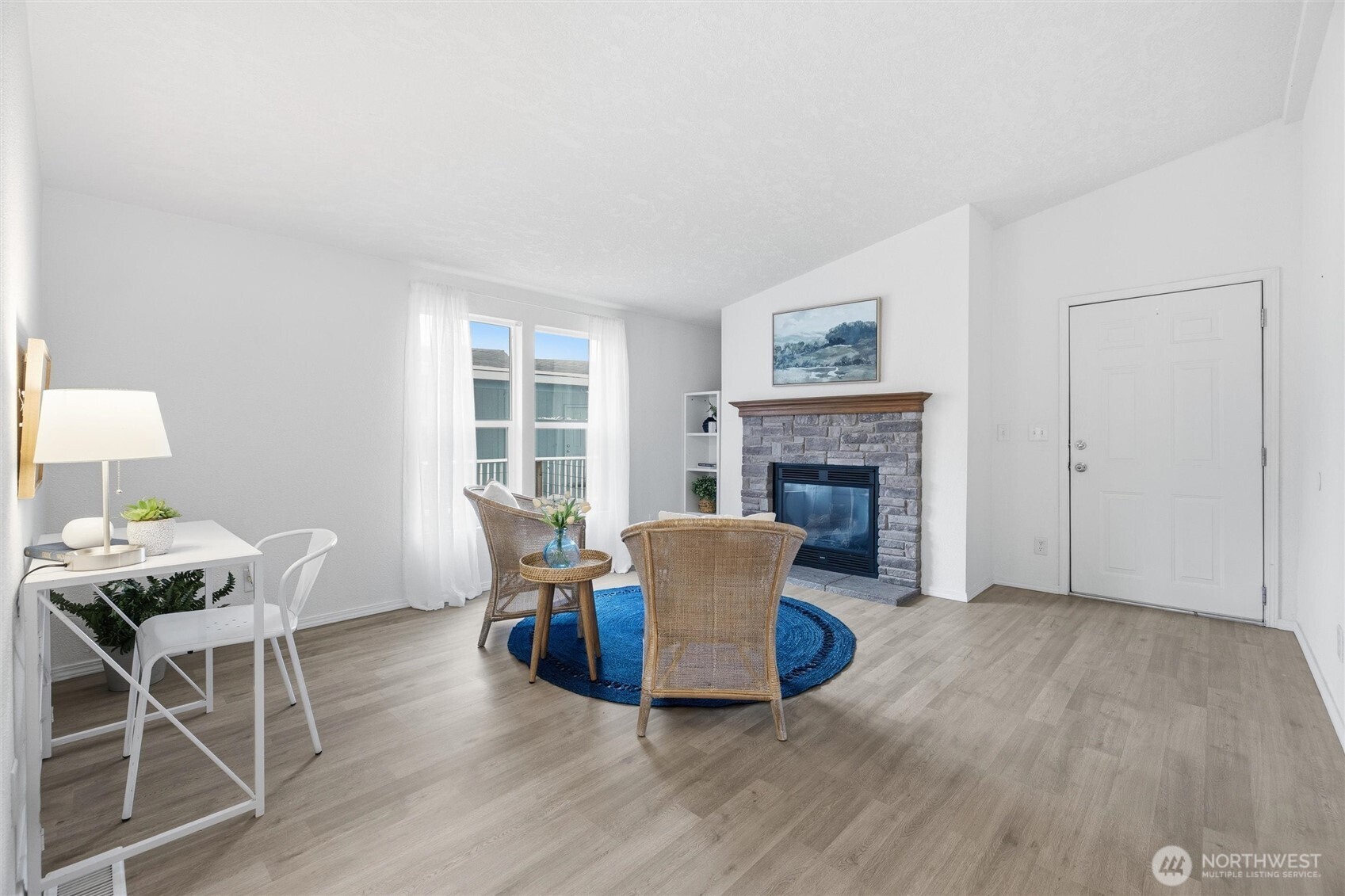 579 Lupine Lane, Unit 16 Burlington, WA 98233 - Photo 27 of 37 a living room with furniture and a fireplace