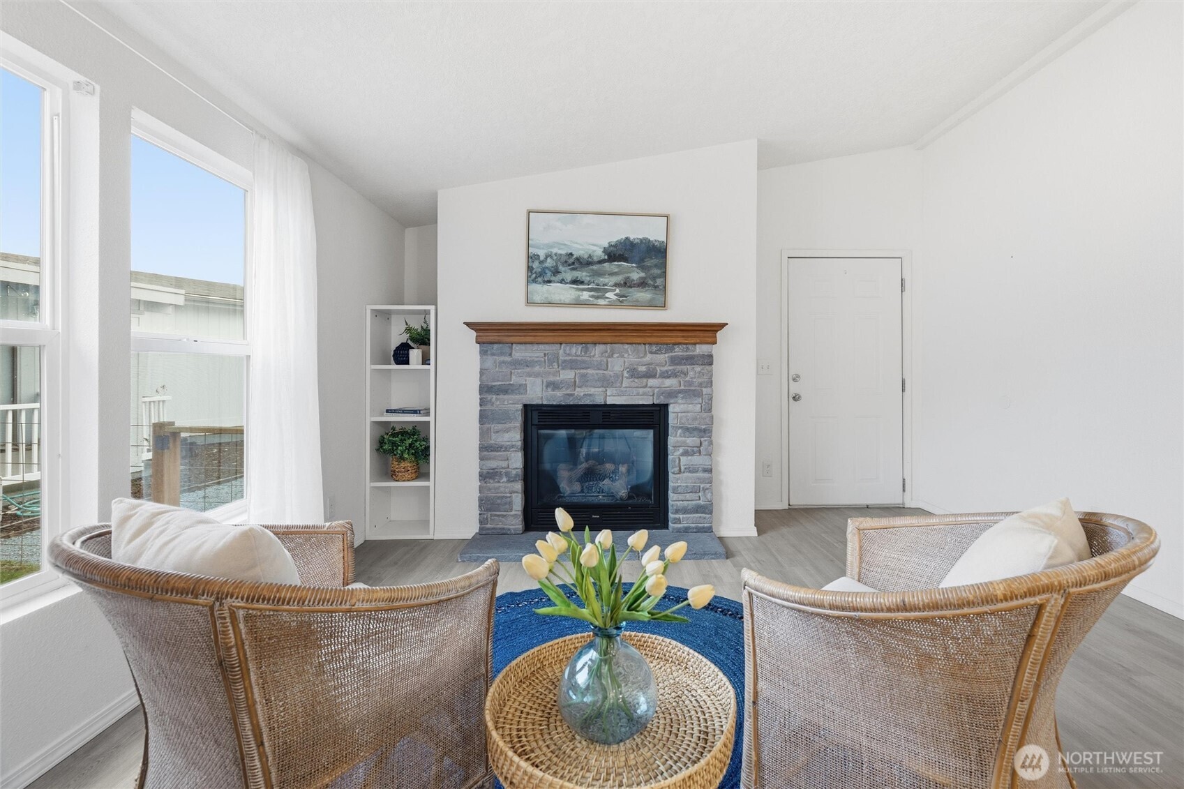579 Lupine Lane, Unit 16 Burlington, WA 98233 - Photo 29 of 37 a living room with furniture and a fireplace
