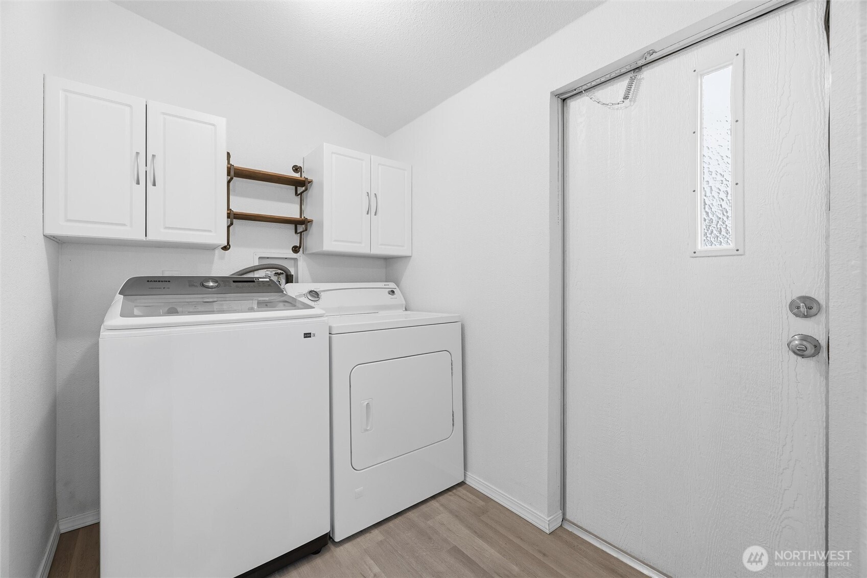 579 Lupine Lane, Unit 16 Burlington, WA 98233 - Photo 31 of 37 a utility room with cabinets washer and dryer
