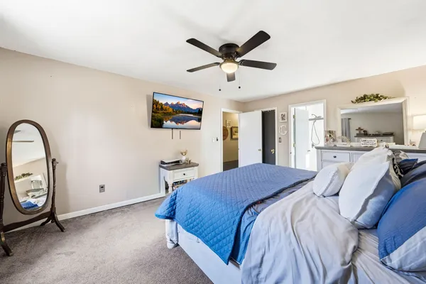 a bed room with a bed and a television