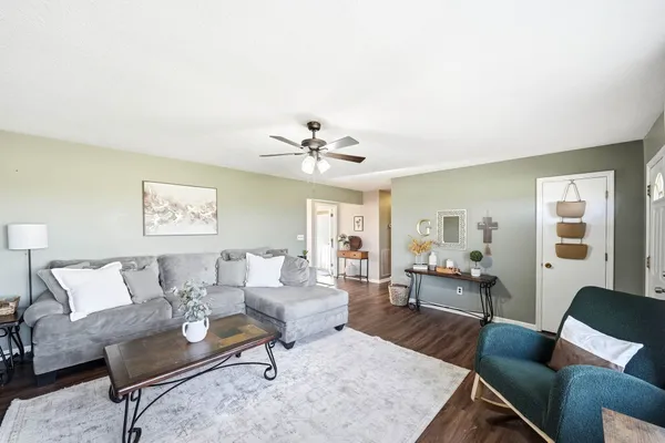 a living room with furniture and a large window
