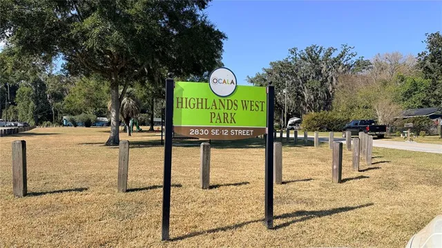 a view of a park with large trees