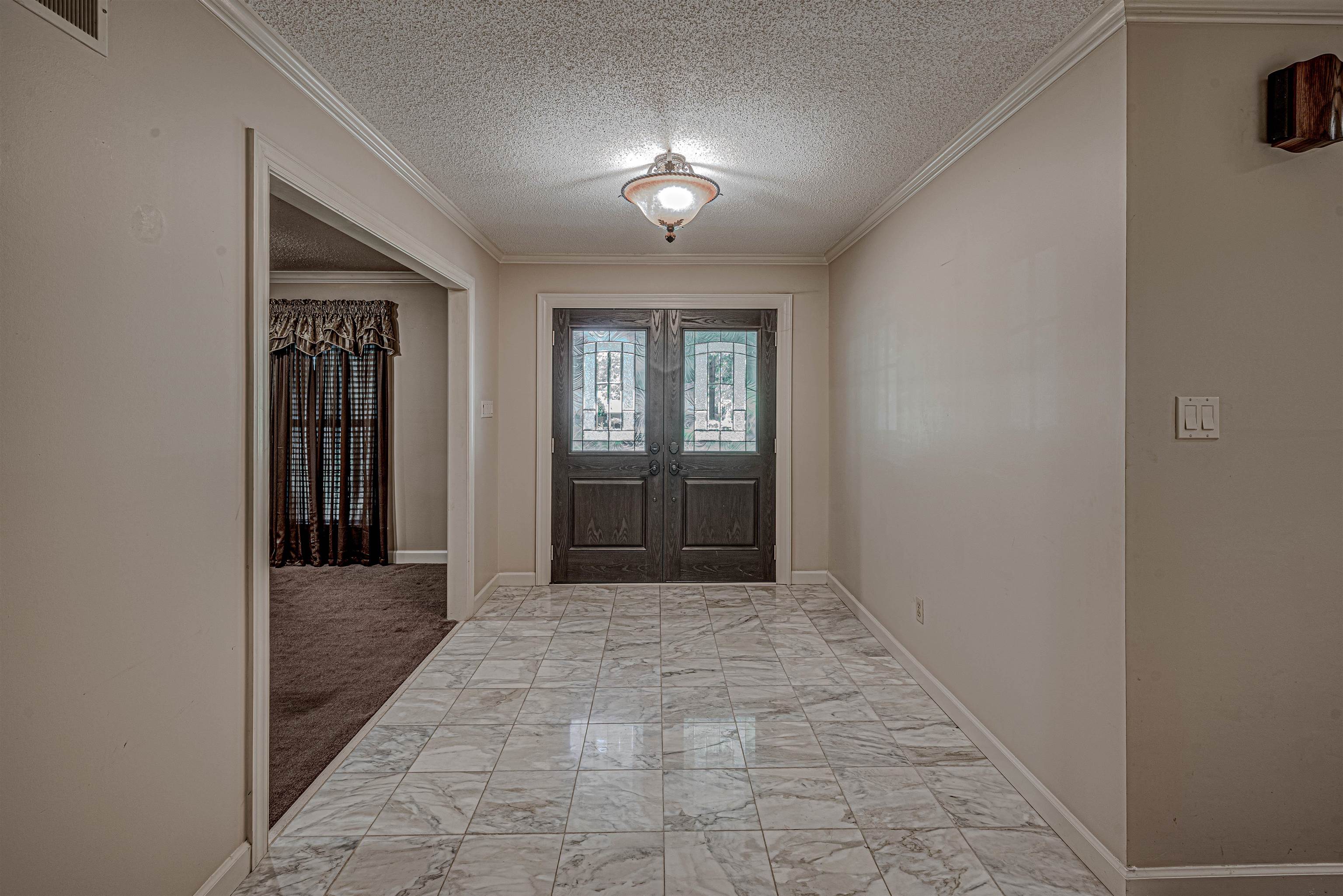710 Poplar Acres Road Piperton, TN 38017 - Photo 2 of 24 The generous entry hall greets you with double doors and marble floors.