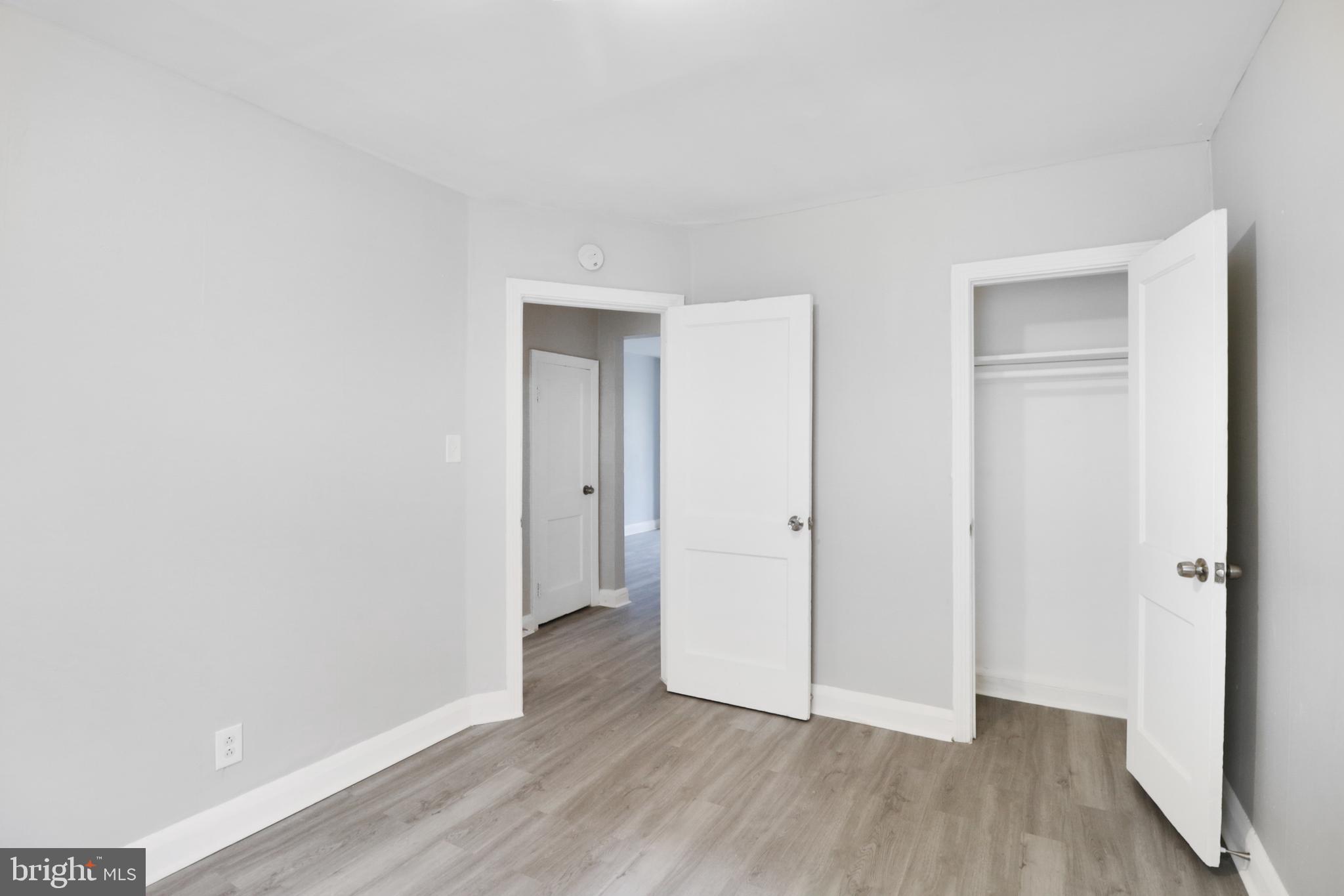 6151 Chinquapin Parkway Baltimore, MD 21239 - Photo 9 of 22 a view of hallway with wooden floor