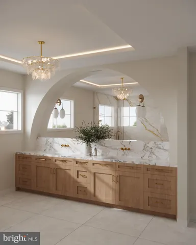 a bathroom with a granite countertop double vanity sink and mirror