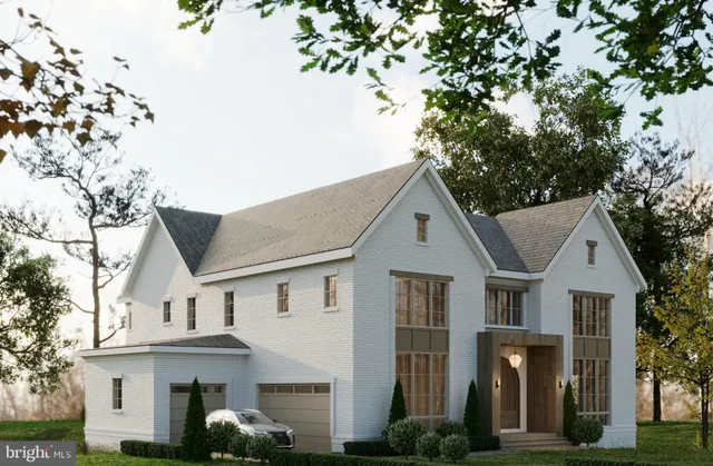 a view of a white house next to a yard with large trees