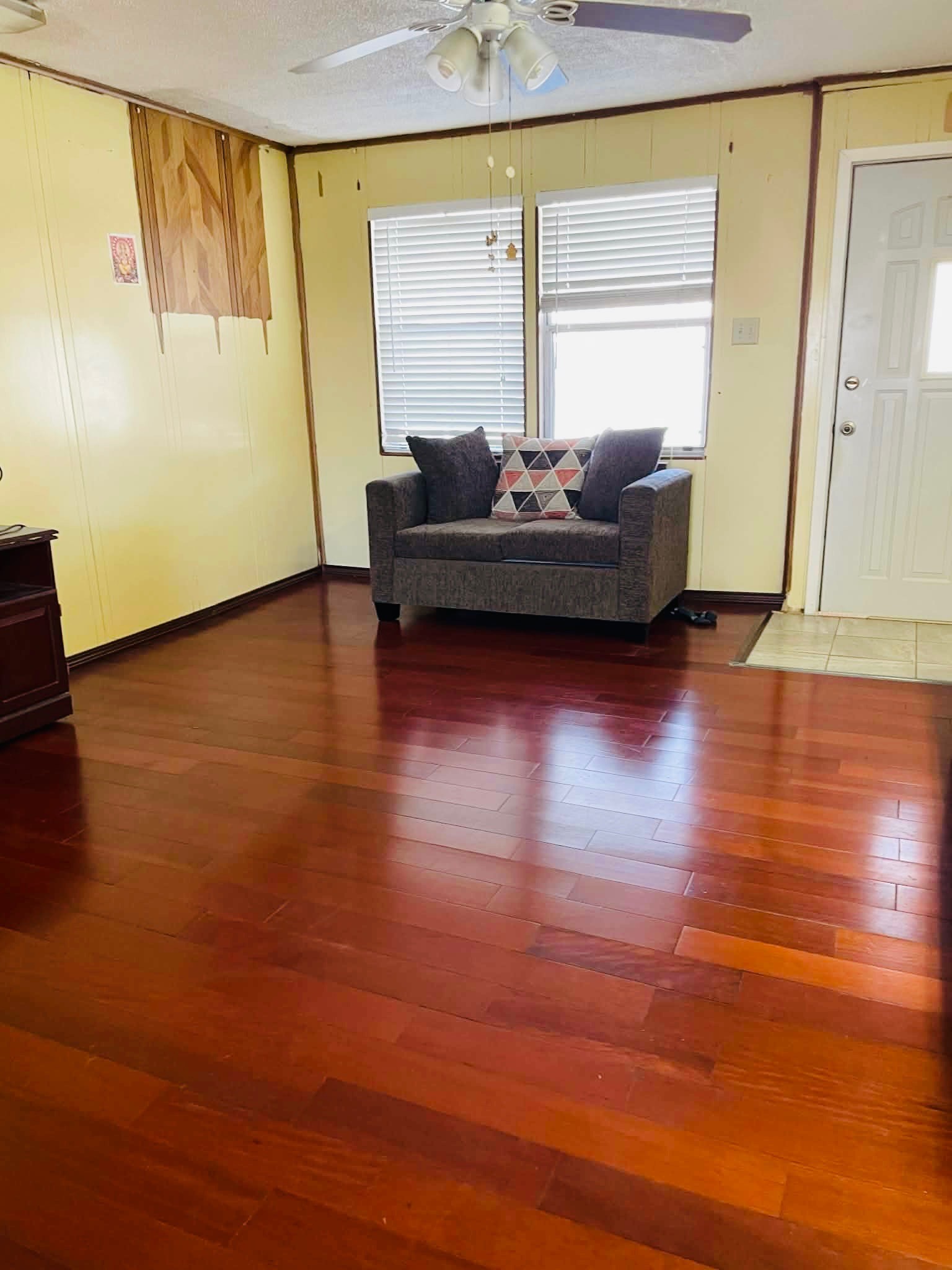 1825 Isom Street Houston, TX 77039 - Photo 11 of 27 a living room with hard wood floors and a wooden floor