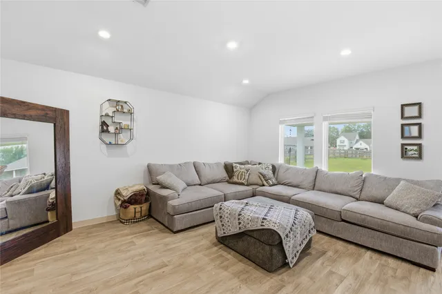 a living room with furniture and a large window