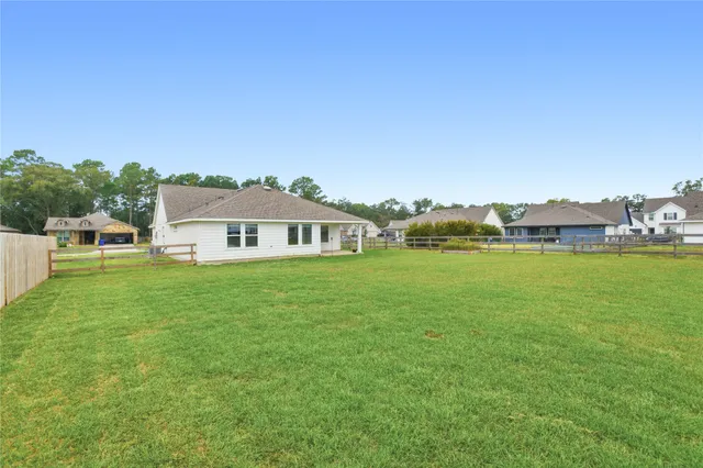 a view of a house with a big yard